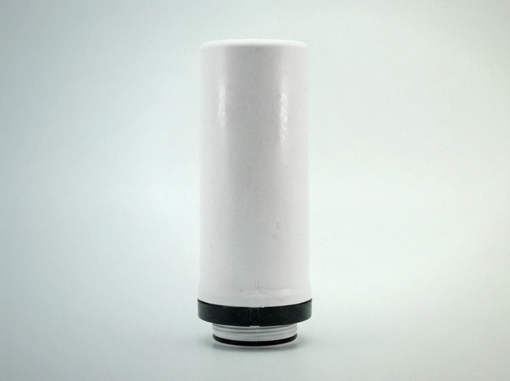 White cylindrical refrigerator water filter cartridge on a plain background, threaded connector facing down