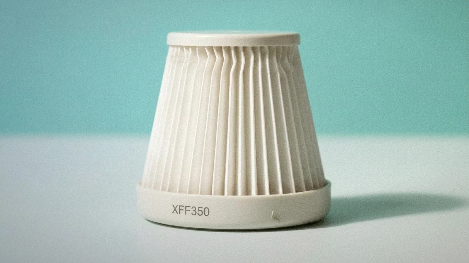 Unbranded compact pleated HEPA vacuum filter representing Shark XFF350/XHF350 compatibility